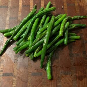 Fresh sautéed green beans served as a homestyle BBQ side dish at Tutta’s BBQ.
