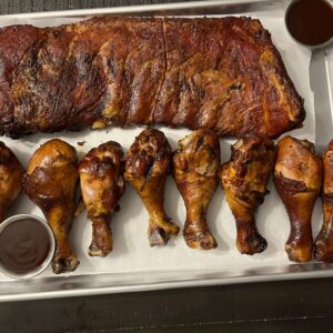 Tutta’s BBQ Family Meal with a full rack of slow-smoked ribs and chicken legs served in Marion County, Indiana