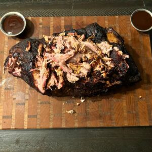 Smoked pulled pork on wooden board